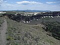 The layers of basalt that form the top of the plateau are exposed where glaciation has carved valleys.