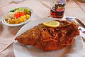 Fried carp with beer and salad