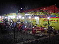 Lesehan sit on the mat dining at Malioboro street, Yogyakarta.