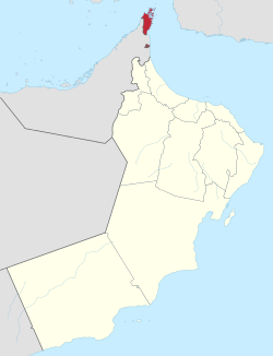Musandam Governorate of Oman. The exclave of Madha is indicated in red below the Musandam Peninsula.