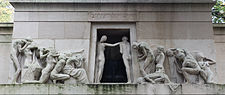 A couple enter the darkness of the tomb.