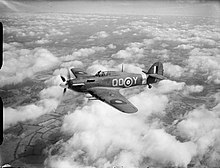 a black and white photograph of an aircraft in flight