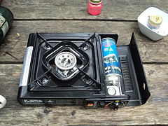 Camp stove with can of butane fuel