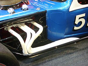 Long tube headers (in white) on a racing car