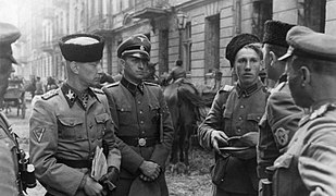 German SS-Gruppenführer Heinz Reinefarth, the "Butcher of Wola" (left, in Cossack headgear) with Jakub Bondarenko, commander of Kuban Cossack Infantry regiment, Warsaw Uprising