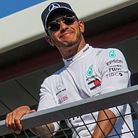 Lewis Hamilton, a black man in his early thirties with short facial hair, at the 2018 British Grand Prix.