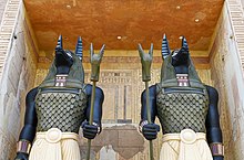 Anubis statues above the entrance to Revenge of the Mummy: The Ride.
