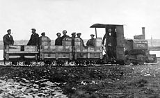 Camber Railway, 1915-1922. The loco has 'Falkland Island Express' handwritten on the tank. The wooden wagon bodies carry removable seats at each end for workmen. The 1st class, 2nd class, 3rd class, and 'Smoker' legends, not to mention that on the loco's tank, seem to imply that the whole thing was seen as a bit of a joke. The photo was later used on a Falkland Islands 54p stamp.