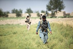 Kilo Company, 3rd Battalion, 8th Marine Regiment, partnered with Afghan National Police, patrol through Garmsir District, June 1, 2012