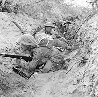 Men of 'D' Company, 1st Battalion, The Green Howards occupy a captured German communications trench during the offensive at Anzio, Italy, 22 May 1944.