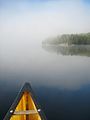 Early morning fog lifts on Burnt Island Lake, Algonquin Park.