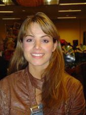 Smiling young woman with long, light-brown hair