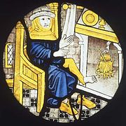 ינואר ליד האח, ציור על זכוכית מאנגליה, בסביבות שנת 1500.