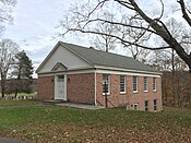 View of front and side elevations of a brick building