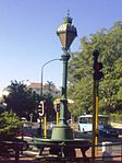 On a traffic island where Belmont Road meets the main road in the centre of Rondebosch stands one of the best-known landmarks in that suburb. It is known as "The Fountain", but it is actually an ornamental trough for watering horses, dating back to 1891. Type of site: Fountain.