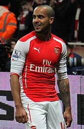 A man in a football uniform, playing in a football match