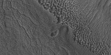 Close view of contact, as seen by HiRISE under HiWish program Picture shows details of how upper plains material is breaking. The formation of many fractures seems to precede the break up.