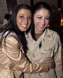 Miss New York USA 2004 Jaclyn Nesheiwat (left) visited U.S. troops in Iraq in March 2004. While in Baghdad, she met her sister, Army Capt. Julie Nesheiwat (right)