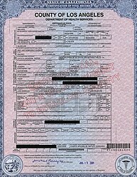 A white piece of paper with personal information about the death of a person. The paper's writing is all in black and has multiple sections blacked-out.