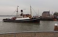 The national arrival of Sinterklaas in Maassluis, tugboast (de Furie) with Zwarte Pieten