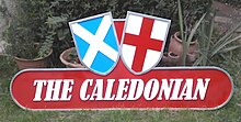 Railway locomotive headboard, the text 'The Caledonian' across the bottom, with the shields of Scotland and England above