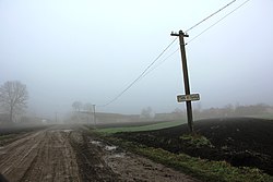 Roadside sign at the entrance to the village