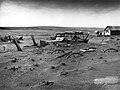 Image 7 Dust Bowl Photo credit: Sloan, USDA Buried machinery in a barn lot, Dallas, South Dakota, United States, due to Dust Bowl conditions, May 1936. Dust storms from 1930–1939 caused major ecological and agricultural damage to American and Canadian prairie lands. This ecological disaster was a result of drought conditions coupled with decades of extensive farming using techniques that promoted erosion. More featured pictures