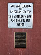 Detailed view of the sign and plaque.