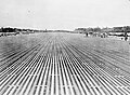 View of the main runway at RAF Changi, Singapore, soon after its completion. The runway constructed from 276,680 pierced steel sheets was 2,000 yards in length and 50 yards wide was able to take the largest aircraft then in service with the RAF.