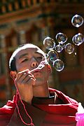 Blowing bubbles through a small wand