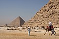 Image 31Tourists riding an Arabian camel in front of Pyramid of Khafre. The Giza Necropolis is one of Egypt's main tourist attractions. (from Egypt)