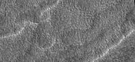 Close-up of scalloped ground, as seen by HiRISE under HiWish program. Surface is divided into polygons; these forms are common where ground freezes and thaws. Note: this is an enlargement of a previous image.