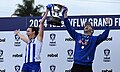 Captain Jess Jones (L) and coach Brett Gourley (R) celebrate with the premiership cup