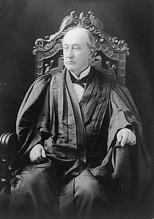Black-and-white photograph of Brewer, seated and wearing his judicial robes