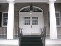 A federal fan-style window in the entrance of Frontier House.