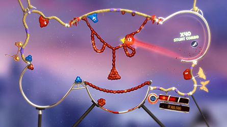 A screenshot showing a small red blob hurling across a level in the shape of an elephant head