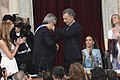 President–elect Alberto Fernández receives the presidential sash and staff from outgoing president Mauricio Macri in 2019