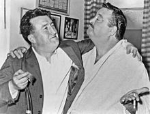 Gleason standing with Irish author Brendan Behan, arms around each other