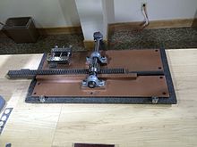 A photograph of a hand-cranked machine
