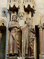 Gothic sculptures of a noble couple, part of cathedral decorations