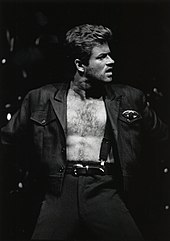 A man with an open shirt