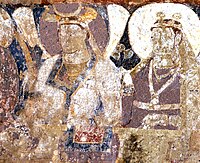 Probable Hepthalite rulers of Tokharistan, with single-lapel caftan and single-crescent crown, in the lateral row of dignitaries next to the Sun God.[34][35][31]