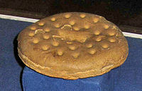 A ship's biscuit—purportedly (c. 1852) the oldest in the world—displayed at the maritime museum in Kronborg, Denmark