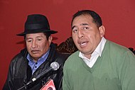 Wilson Santamaría and Rafael Quispe speak at a press conference.