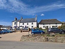 The rebuilt Anchor Inn and rebuilt neighbouring cottages at Seatown, Dorset, England.