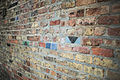 Brick Wall with a few colorful bricks