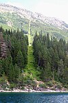 49th parallel at Waterton Lake, showing the cleared strip of land along the U.S./Canadian border.