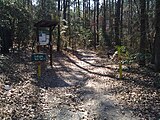 Sign upon a trail in the woods.