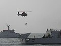 CGA patrol vessels and National Airborne Service Corps (NASC) helicopter outside of Port of Kaohsiung