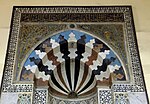 Mihrab with central "sunrise" motif and glass mosaics in the spandrels above, at the Taybarsiyya Madrasa (1304) at Al-Azhar Mosque